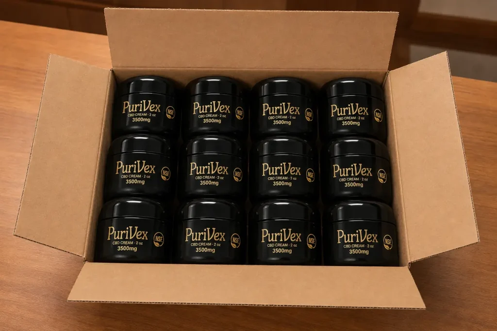A shipping box of twelve Purivex jars opened on a counter